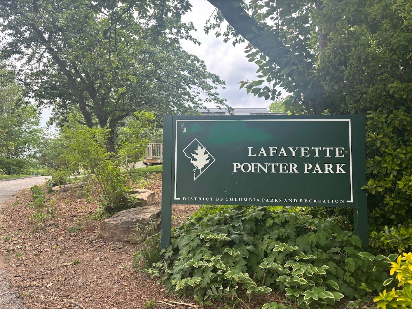 The Lafayette-Pointer Park entrance sign with surrounding greenery